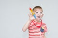 Sad boy playing doctor. Toy syringe, glasses and phonendoscope. Royalty Free Stock Photo