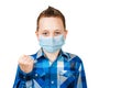 Sad Boy show his fist, wearing a protective face mask prevent virus infection or pollution on white isolated background Royalty Free Stock Photo