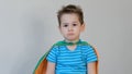 Sad boy superhero. little boy playing a superhero. Kid in an Superhero`s costume. child green mask, nature care concept Royalty Free Stock Photo