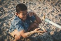 Sad boy want to drink some water on crack ground Royalty Free Stock Photo