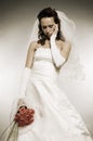 Sad bride with bunch of roses Royalty Free Stock Photo