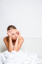 Sad bride crying sitting on a sofa, smitten, pondering Royalty Free Stock Photo