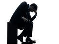 Sad business man sitting pensive silhouette Royalty Free Stock Photo