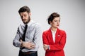 The sad business man and woman conflicting on a gray background Royalty Free Stock Photo