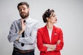 The sad business man and woman conflicting on a gray background Royalty Free Stock Photo