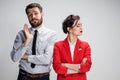 The sad business man and woman conflicting on a gray background Royalty Free Stock Photo