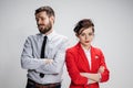 The sad business man and woman conflicting on a gray background Royalty Free Stock Photo