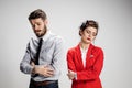 The sad business man and woman conflicting on a gray background Royalty Free Stock Photo