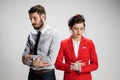 The sad business man and woman conflicting on a gray background Royalty Free Stock Photo