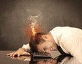 Sad business person`s head catching fire Royalty Free Stock Photo