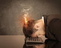 Sad business person`s head catching fire Royalty Free Stock Photo