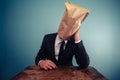 Sad businessman with bag over his head Royalty Free Stock Photo