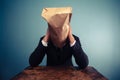 Sad businessman with bag over his head Royalty Free Stock Photo