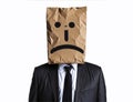 A sad businessman with a paper bag on his head, bearing an emoji emotion face Royalty Free Stock Photo