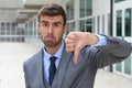 Sad businessman showing a thumbs down Royalty Free Stock Photo
