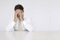 Sad Businessman Sitting At Desk In Office Royalty Free Stock Photo