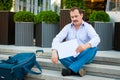 Sad businessman sitting on the steps Royalty Free Stock Photo