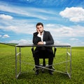 Sad businessman sitting at table Royalty Free Stock Photo