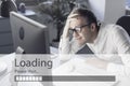 Sad businessman staring at the lagging loading bar Royalty Free Stock Photo