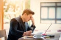 Sad businessman stressed and worried sitting in office. Stress and worry concept. Vintage tone Royalty Free Stock Photo