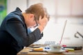 Sad businessman stressed and worried sitting in office. Stress and worry concept. Vintage tone Royalty Free Stock Photo