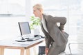 Sad businesswoman having back pain Royalty Free Stock Photo