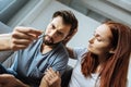 Sad cheerless man looking at his pill Royalty Free Stock Photo