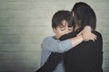 Sad child hugging his mother Royalty Free Stock Photo