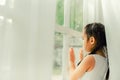 Sad child, Little girl looking the rain Royalty Free Stock Photo