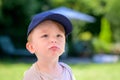 Sad Child Wearing Blue Cap Royalty Free Stock Photo