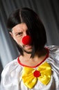 Sad clown against Royalty Free Stock Photo