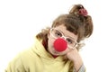 Sad clown nose little girl with big glasses Royalty Free Stock Photo