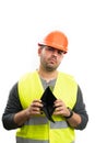 Sad constructor man presenting empty wallet as poor concept Royalty Free Stock Photo