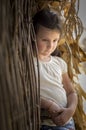 Sad countryside girl in corn