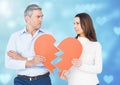 Sad couple holding broken heart Royalty Free Stock Photo