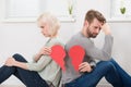 Sad Couple Holding Red Broken Heart Royalty Free Stock Photo