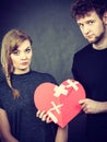 Sad couple holds broken heart Royalty Free Stock Photo