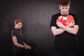 Sad couple holds broken heart. Royalty Free Stock Photo