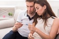 Sad couple after pregnancy test result copy space Royalty Free Stock Photo