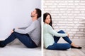 Sad Couple Sitting On Floor Royalty Free Stock Photo