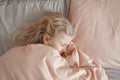 Sad crying child girl lying under blanket in bed. Sad kid in stress frustration. Child lying in tears in depression, frustration, Royalty Free Stock Photo