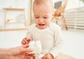 Close-up, crying baby, does not want to play toys with mom Royalty Free Stock Photo