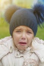 Sad crying offended girl cold autumn outdoor. Concept of upset child Royalty Free Stock Photo