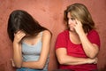 Sad crying teenage girl and her worried mother Royalty Free Stock Photo