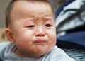 Sad cute asian baby watching out Royalty Free Stock Photo