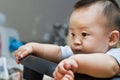 Sad cute asian baby watching out Royalty Free Stock Photo