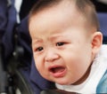 Sad cute asian baby watching out Royalty Free Stock Photo