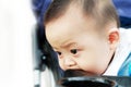 Sad cute asian baby watching out Royalty Free Stock Photo