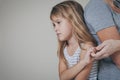 Sad daughter hugging his mother at home. Royalty Free Stock Photo