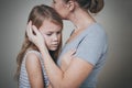 Sad daughter hugging his mother at home. Royalty Free Stock Photo